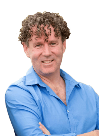 A man with curly brown hair wearing a blue shirt